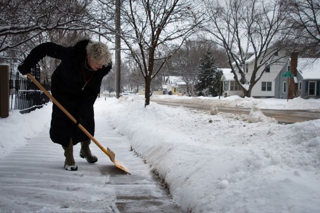 Person shoveling sidwalk